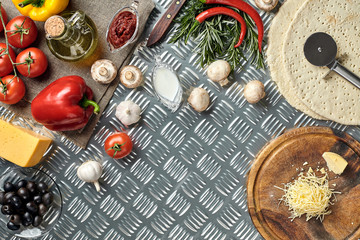 Fototapeta na wymiar Cheese, different vegetables on metal table. Ingredients for traditional italian pizza.