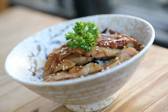 japanese food , Chicken teriyaki with rice on wood background