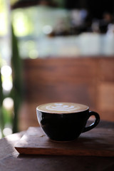 Cappuccino coffee break on wood background