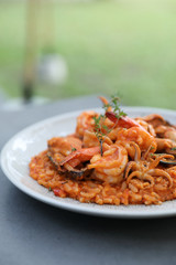 seafood risotto with mussel shrimp and squid , italian food