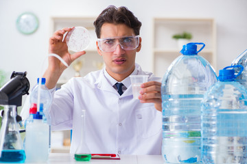 Lab assistant testing water quality