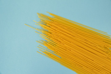 spaghetti on blue background