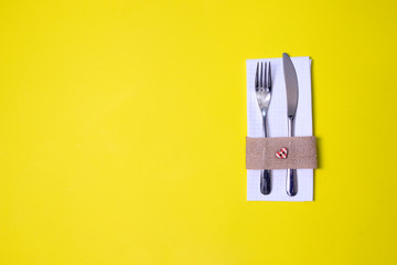 white napkin, knife and fork, place for dinner served in rustic style