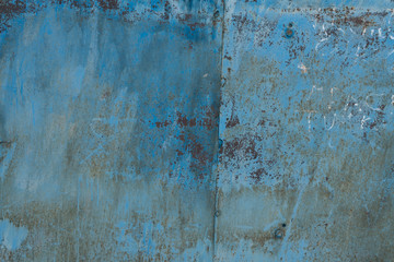Old worn metal surface with paint. Rusty metal texture. Background. Metal. Wall.