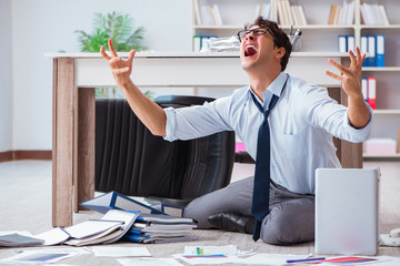 Bankrupt businessman angry in the office floor