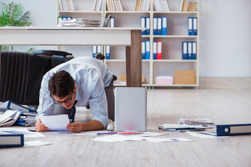 Bankrupt businessman angry in the office floor