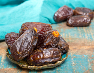 Traditional Middle East dessert, healthy food, big medjool dates fruits.