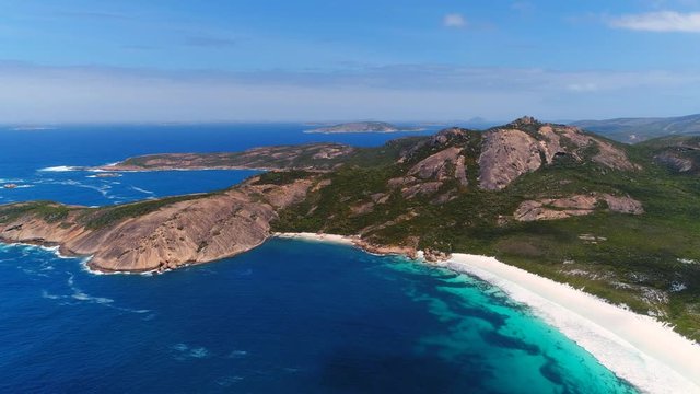 Aerial view of picturesque coastline of Hellfire Bay, colorful cliffs and rocks protruding above crystal clear waters of Southern Ocean - Cape Le Grand, Esperance, Western Australia from above, 4k UHD