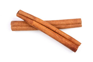 Cinnamon sticks isolated on white background. Top view