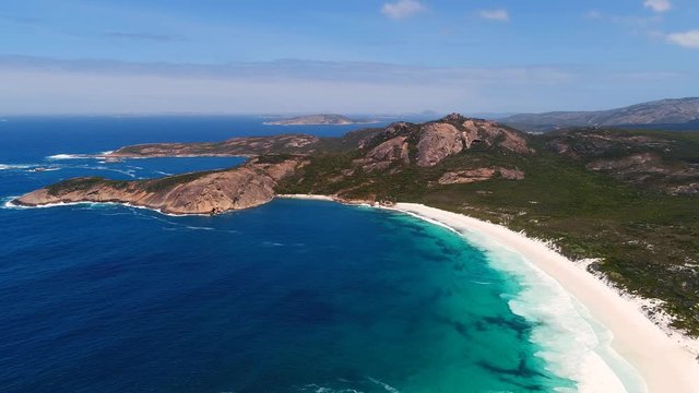 Aerial view of picturesque coastline of Hellfire Bay, colorful cliffs and rocks protruding above crystal clear waters of Southern Ocean - Cape Le Grand, Esperance, Western Australia from above, 4k UHD