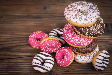 Colorful glazed donuts with sprinkles