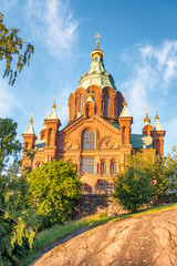 Fototapeta na wymiar Uspenski Cathedral andcity trees in summer season, Helsinki