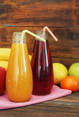 Fresh organic fruit Juice in glass Bottle on rustic wooden wood Background. Healthy life living Diet and fitness.
