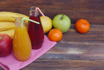 Fresh organic fruit Juice in glass Bottle on rustic wooden wood Background. Healthy life living Diet and fitness.