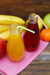 Fresh organic fruit Juice in glass Bottle on rustic wooden wood Background. Healthy life living Diet and fitness.