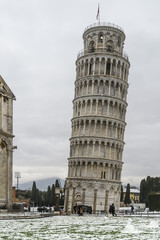 Fototapeta na wymiar The Leaning Tower of Pisa after a snowfall, Tuscany, Italy