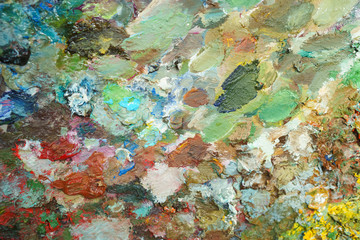textural multicolored palette of a background of paints made by a brush