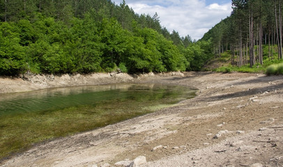 Muddy shores of the lake during the drought
