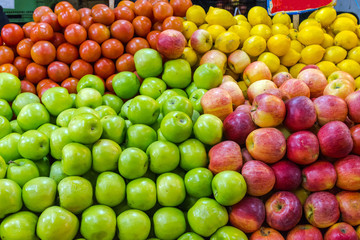 Apples, lemons and tomatoes for sale at a market in Santiago de Chile