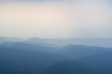 Mountain layer in morning winter fog.