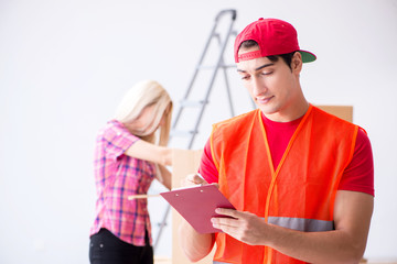Young delivery assistant delivering to home