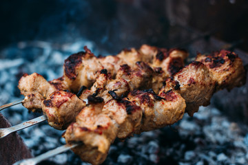 Three skewers of fried shish kebab