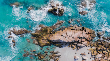 The bird eye view of sea scape and group of beach stones.