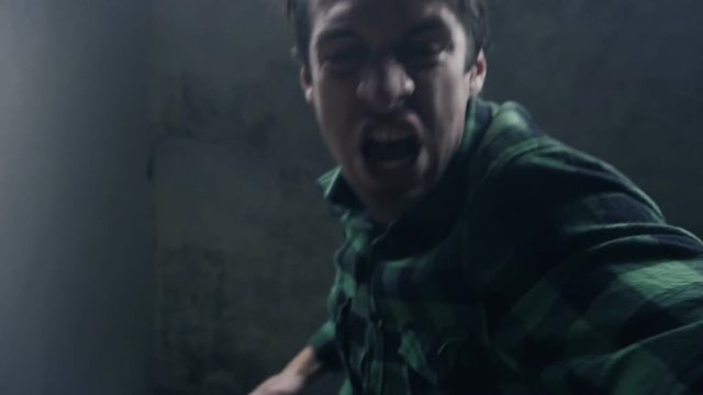 furious aggressive man beats with his fists the lying person