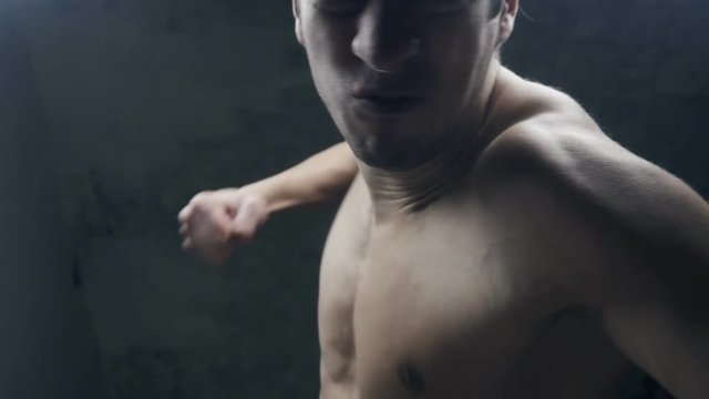 furious aggressive man beats with his fists the lying person