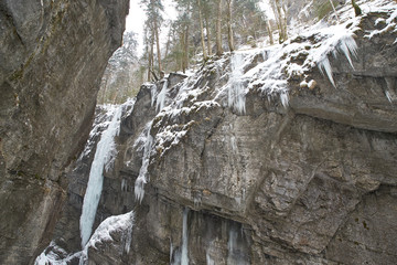 Frozen waterfall with icicles seen in the park