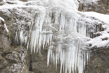 Frozen waterfall with icicles seen in the park