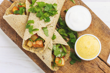 Vegetarian masala dosa with potato, chutney and sambar sauces.