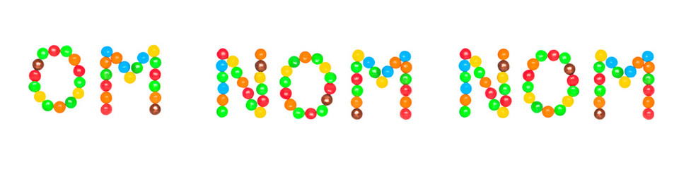 The text OM NOM NOM is written by sweet colorful chocolate candy isolated on white background