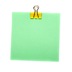 green Stick Note with yellow paper clip holder isolated on white background. Mock up