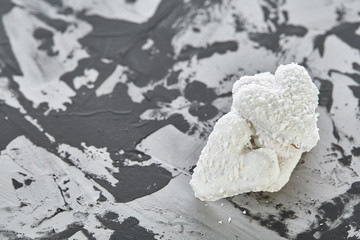 Coconat biscuits arranged in pattern on light textured background, close-up, shallow depth of field, selective focus.