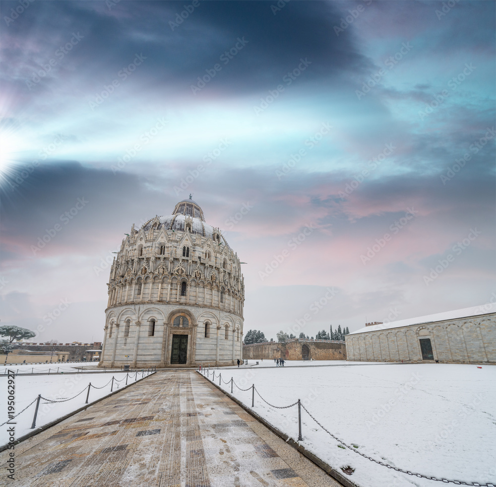 Sticker Baptistery of Pisa after a winter snowfall at sunset. Square of Miracles at dawn