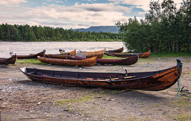 Wooden boats on the bank of river, Finnmark, Norway