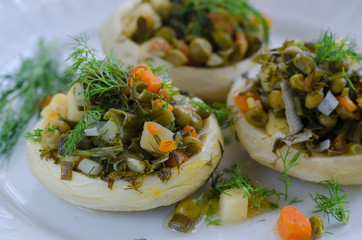 Artichokes filled with potatoes, peas, onions, carrots. Delicious healthy vegetarian food.
