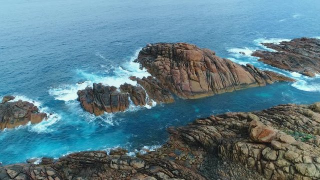 Aerial view of Canal Rocks, picturesque rocks formations protruding above crystal clear waters of Southern Ocean, Western Australia from above, 4k UHD