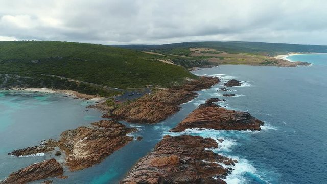 Aerial view of Canal Rocks, picturesque rocks formations protruding above crystal clear waters of Southern Ocean, Western Australia from above, 4k UHD
