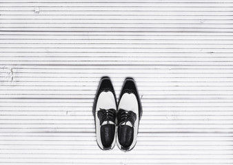 new black leather elegant shoes on white floor