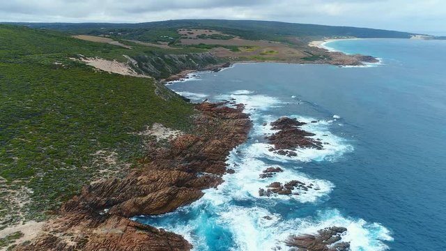 Aerial view of Canal Rocks, picturesque rocks formations protruding above crystal clear waters of Southern Ocean, Western Australia from above, 4k UHD