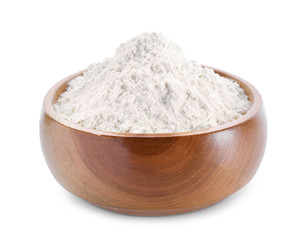 Wheat flour in wooden bowl on white background