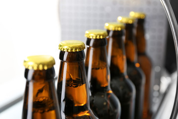 Bottles of beer in brewery, closeup