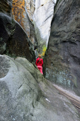 Tourist visiting the rock city in Adrspach, Czech Republic