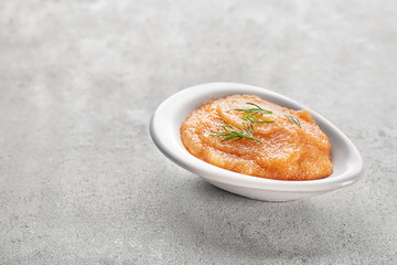 Bowl with codfish caviar on table