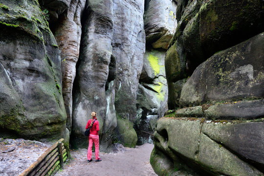 Tourist visiting the rock city in Adrspach, Czech Republic