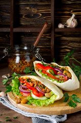 Pita bread sandwiches with meat, beans and vegetables