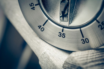 35 Minutes - Macro Of An Analog Chrome Kitchen Timer On Wooden Table