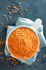 Raw lentil in bowl on table. Fresh lentils. Vegetarian food. Top view